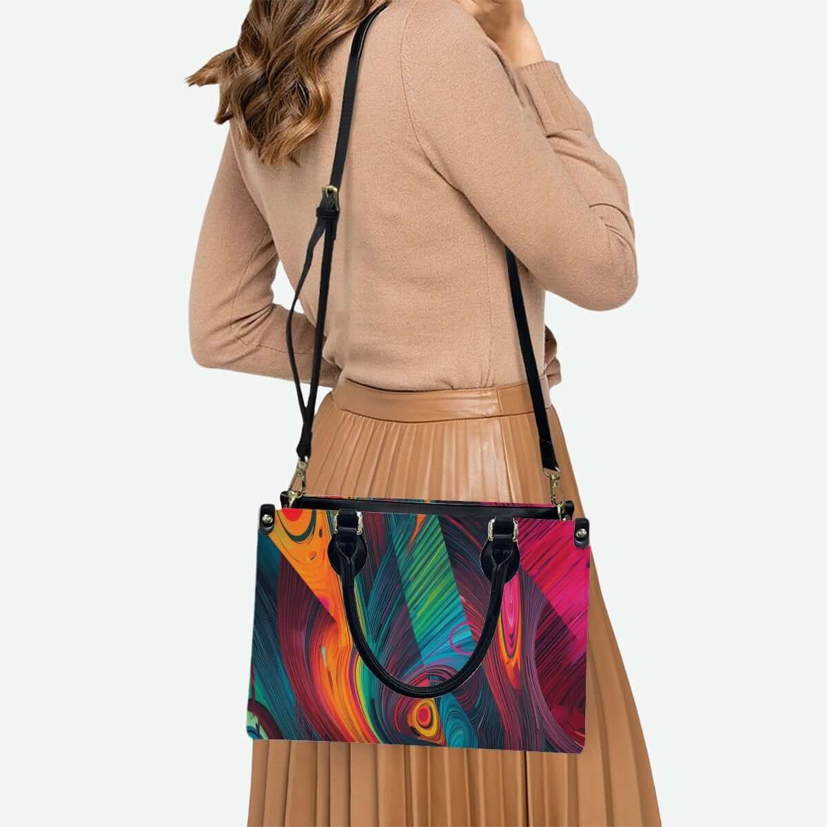 Stylish woman carrying a colorful PU Tote Bag for Women with black handles, showcasing vibrant UV printed patterns.