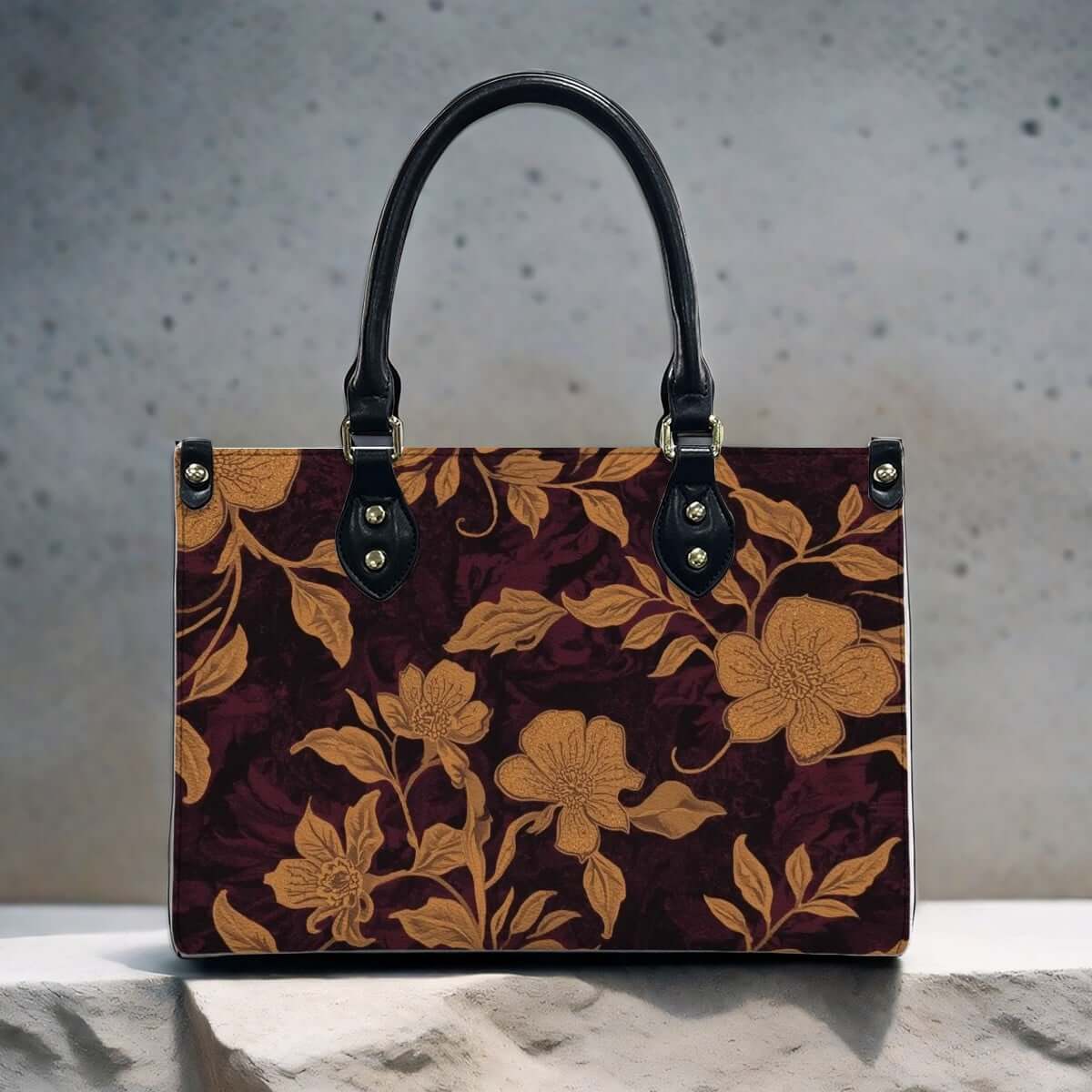PU Tote Bag for Women with floral pattern and black handles on display