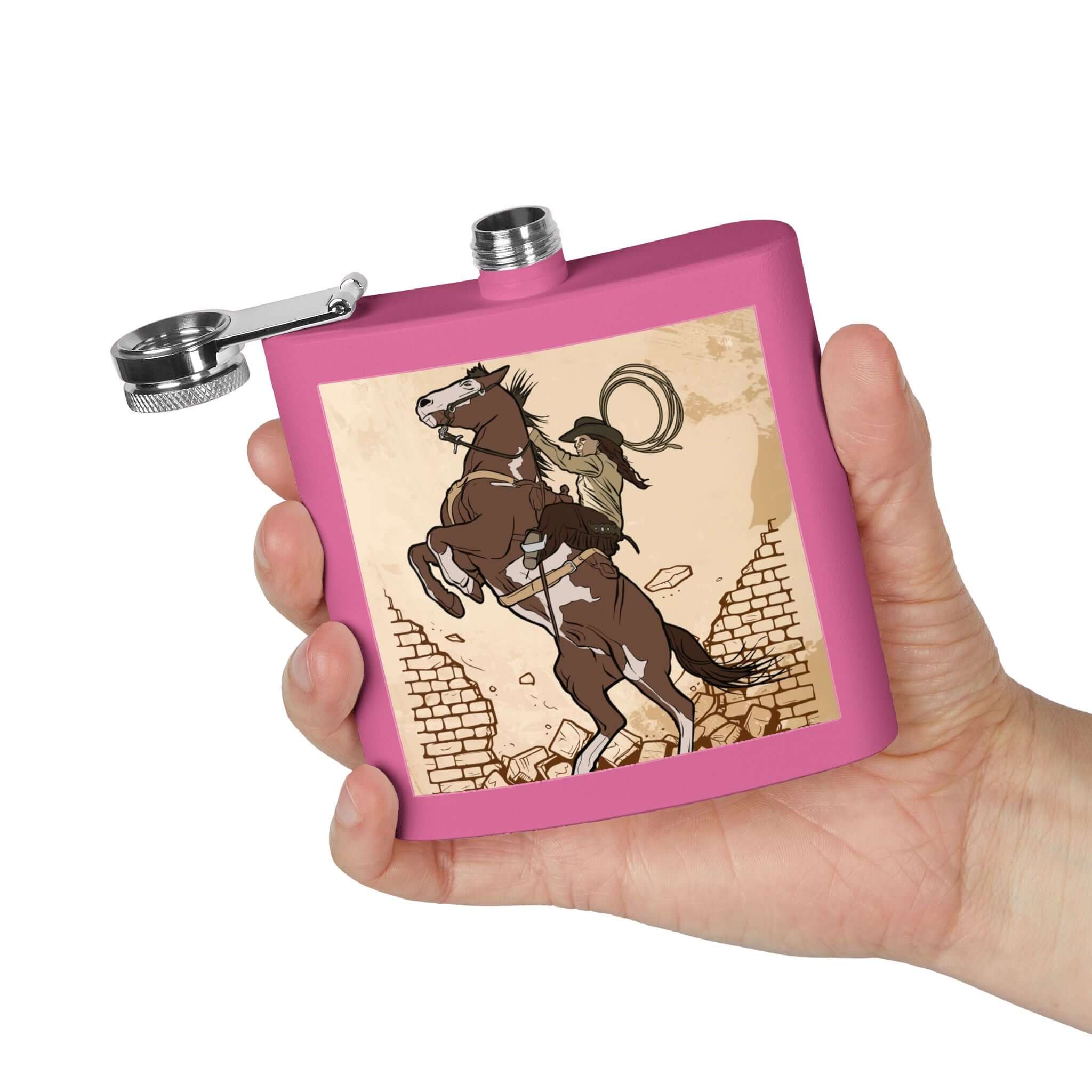Edelstahl-Flachmann mit Cowboy-Motiv in einer Hand, 6-Unzen, langlebig, rosa Design. Details für Edelstahl-Flachmann mit Cowboy-Motiv ansehen.