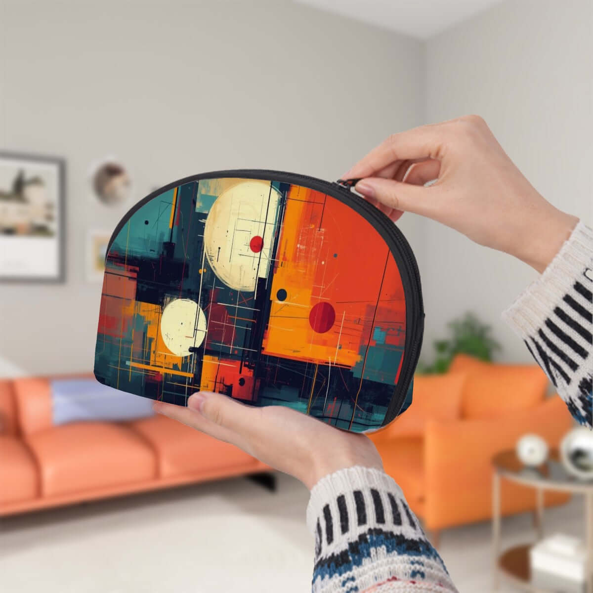 Colorful abstract art storage bag held by hands against a living room background, featuring the Storage Bags Set of 2 design.