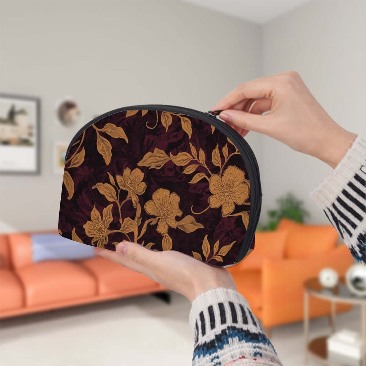 Hands holding a polyester storage bag from the Storage Bags Set of 2 with floral design, showing single-sided sublimation printing.