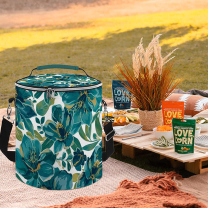Camping-Kühltasche mit Blumenmuster, tragbar und wasserdicht, auf einem Picknicktisch im Freien, ideal für Campingausflüge.