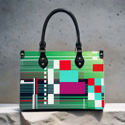 Bunte PU-Tragetasche für Damen mit Mustern auf grauem Hintergrund