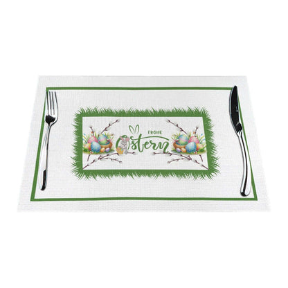 Tischset aus gewebtem PVC mit Osterdesign und Beschriftung "Frohe Ostern", hitzebeständig bis 80 °C, kratzfest und rutschfest.