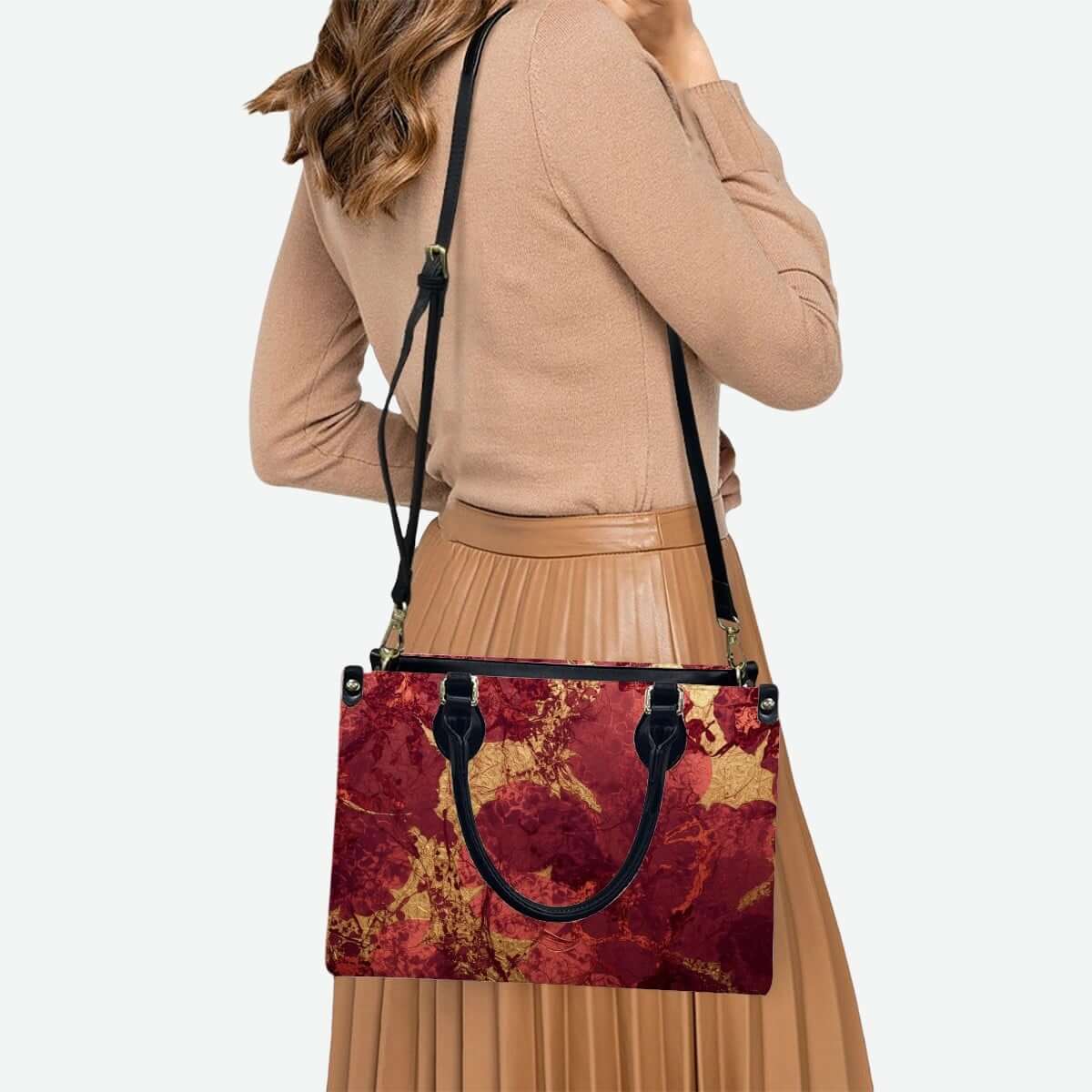 PU Tote Bag for Women with red and gold pattern design, carried by a woman in a beige sweater and pleated skirt