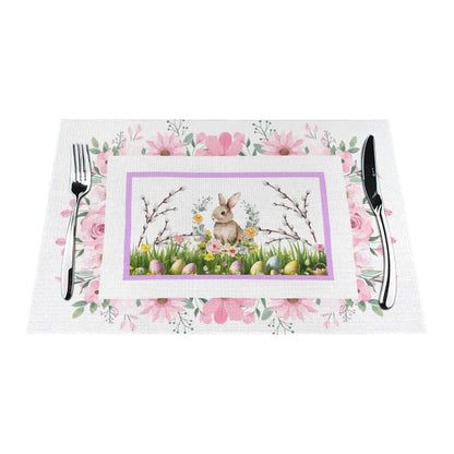 Tischset aus gewebtem PVC mit Osterhasen-Motiv und Blütendesign in Rosa, hitzebeständig und kratzfest, ideal für den Esstisch.