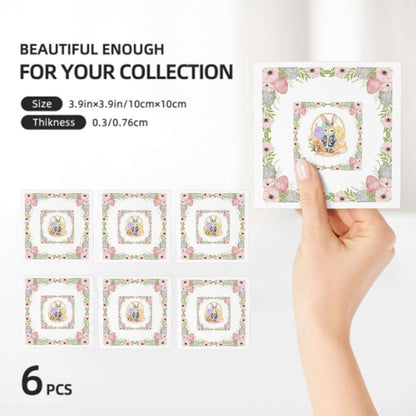 Quadratische Keramikuntersetzer, 6 Stück, mit Blütenmotiv, 4x4 Zoll, umweltfreundlich, handgehaltene Ansicht, ideal für Ihr Zuhause.