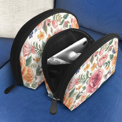 Blumiges Aufbewahrungsbeutel-Set (2 Stück) aus Polyester auf blauem Sofa mit Reißverschluss und großer Kapazität, perfekt für den täglichen Gebrauch.